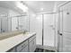 Well-lit bathroom showcasing a double vanity, quartz countertop, subway tile shower, and sleek design at 334 Ladybird Ln, Pineville, NC 28134