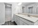 Bathroom with double vanity, granite countertop, walk in closet, and modern fixtures at 334 Ladybird Ln, Pineville, NC 28134