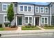 Charming two-story townhomes featuring gray siding, well-maintained landscaping, and inviting front entrances at 334 Ladybird Ln, Pineville, NC 28134