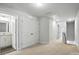 Upstairs hallway with a bedroom door to the left and stairs to the right at 334 Ladybird Ln, Pineville, NC 28134