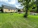 Spacious backyard featuring a lush lawn, above ground pool and single story home at 3396 Farm Lake Sw Dr, Concord, NC 28027