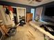 Bedroom with blue walls, laminate flooring, closet and some furnishings at 3396 Farm Lake Sw Dr, Concord, NC 28027