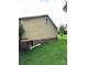 Exterior view of home with visible foundation, yard, and access point at 3396 Farm Lake Sw Dr, Concord, NC 28027