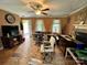 Living room with plywood flooring, fireplace and windows for natural light at 3396 Farm Lake Sw Dr, Concord, NC 28027