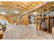 Unfinished basement with open ceiling, exposed framing, and concrete floor at 408 Covington Xing, Matthews, NC 28104
