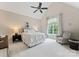 Bright bedroom featuring a ceiling fan, a large window and neutral walls and carpet at 408 Covington Xing, Matthews, NC 28104