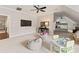 Spacious bonus room with plenty of space to play, a television, and a desk at 408 Covington Xing, Matthews, NC 28104