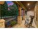Cozy front porch featuring stone columns, rocking chairs, and a peaceful outdoor seating area at 408 Covington Xing, Matthews, NC 28104