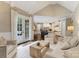Open concept living room flows into the kitchen and dining area with access to the outdoors at 408 Covington Xing, Matthews, NC 28104