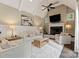 Bright living room features vaulted ceilings, a fireplace, and hardwood floors at 408 Covington Xing, Matthews, NC 28104