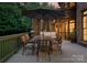 Spacious wooden deck with an outdoor dining area, grill, and comfortable seating, ideal for gatherings at 408 Covington Xing, Matthews, NC 28104