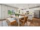 Well-lit dining area with a large window, adjacent to the kitchen and featuring modern decor at 4121 Vista Pine Dr, Charlotte, NC 28215