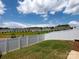 View of fenced backyard with green grass and view of neighboring homes at 4177 Steel Way, Sherrills Ford, NC 28673