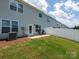 Patio with seating in fenced backyard and exterior of home at 4177 Steel Way, Sherrills Ford, NC 28673
