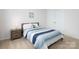 Cozy bedroom with a wood frame bed, side table and closet space at 4177 Steel Way, Sherrills Ford, NC 28673