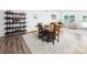 Bright dining area with wood floors, a wooden dining table, and a bar and shelving unit at 4177 Steel Way, Sherrills Ford, NC 28673