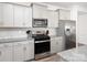 Modern kitchen features stainless steel appliances, granite countertops, and ample cabinet space at 4177 Steel Way, Sherrills Ford, NC 28673