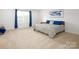Spacious main bedroom featuring a plush carpet, large window, and comfortable bed at 4177 Steel Way, Sherrills Ford, NC 28673