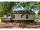 Backyard view of home featuring a wooden deck and mature trees at 429 Merry Go Dr, York, SC 29745