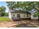 A backyard featuring a small deck, white siding, and shade trees at 429 Merry Go Dr, York, SC 29745