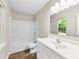 Bright bathroom with a shower-tub combo, large mirror, and white vanity at 429 Merry Go Dr, York, SC 29745