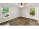 Spacious bedroom with laminate flooring, ceiling fan, and large windows at 429 Merry Go Dr, York, SC 29745