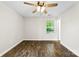 A bright, unfurnished room showcasing wood-look flooring and a ceiling fan for comfort at 429 Merry Go Dr, York, SC 29745