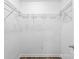 A white, walk-in closet provides ample storage space with its open shelving at 429 Merry Go Dr, York, SC 29745