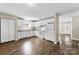 Clean kitchen with white cabinets, appliances, and wood-look flooring at 429 Merry Go Dr, York, SC 29745