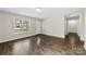 Inviting living room featuring laminate flooring and a bright front window at 429 Merry Go Dr, York, SC 29745