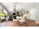 Open dining area with table, chairs, hardwood floors, and view into the living space at 4312 Mary Point Rd, Monroe, NC 28110