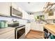Well-equipped kitchen with stainless steel appliances, white cabinets, and hardwood flooring at 4312 Mary Point Rd, Monroe, NC 28110