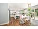 Eat-in kitchen boasts natural lighting, stainless steel appliances, wood floors, and white cabinets at 4312 Mary Point Rd, Monroe, NC 28110