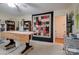 Spacious bonus room with large table and ample storage with a view of the entry hallway at 5014 Quail Canyon Dr, Charlotte, NC 28226