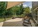 Spacious deck features a sunshade, metal railings with flower boxes, and seating area perfect for outdoor relaxation at 5014 Quail Canyon Dr, Charlotte, NC 28226