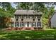 Charming two-story home featuring shutters, window box planters, and a well-manicured front lawn at 5014 Quail Canyon Dr, Charlotte, NC 28226