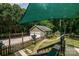 View of detached garage with greenhouse in background, as seen from wood deck at 5014 Quail Canyon Dr, Charlotte, NC 28226