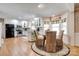 Eat-in kitchen featuring white cabinets, stainless steel appliances, and a breakfast nook at 5014 Quail Canyon Dr, Charlotte, NC 28226