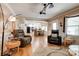 Bright and airy living room flows into a dining area and kitchen with hardwood floors at 5014 Quail Canyon Dr, Charlotte, NC 28226