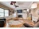 Cozy living room featuring a fireplace, built-in shelving, and hardwood floors at 5014 Quail Canyon Dr, Charlotte, NC 28226