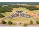 Aerial view of the clubhouse with a parking lot and golf course surrounding it at 5208 Admirals Lndg, Lancaster, SC 29720