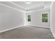 Bedroom with gray walls, plush carpet, and natural light through large windows at 5208 Admirals Lndg, Lancaster, SC 29720