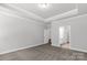 A carpeted bedroom with an ensuite bathroom and well defined ceiling trim at 5208 Admirals Lndg, Lancaster, SC 29720