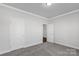 Bright bedroom featuring soft carpet, neutral walls, and ample closet space at 5208 Admirals Lndg, Lancaster, SC 29720