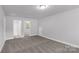 Spacious carpeted bedroom with ensuite bathroom access, featuring neutral paint at 5208 Admirals Lndg, Lancaster, SC 29720