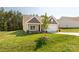 Inviting exterior view of a single Gathering home with a well manicured lawn and 2-car garage at 5208 Admirals Lndg, Lancaster, SC 29720