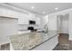 Modern kitchen with granite countertops, stainless steel appliances, and ample cabinet space at 5208 Admirals Lndg, Lancaster, SC 29720