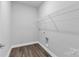 Functional laundry room with wire shelving and connections for washer and dryer at 5208 Admirals Lndg, Lancaster, SC 29720