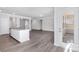 Open-concept kitchen and living area with hardwood floors, stainless appliances, and access to outdoor patio at 5208 Admirals Lndg, Lancaster, SC 29720