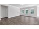 Spacious living space with hardwood floors, neutral walls, and bright windows at 5208 Admirals Lndg, Lancaster, SC 29720